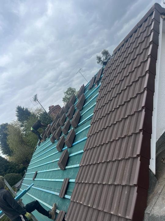 New membrane and battens with the first tiles going on